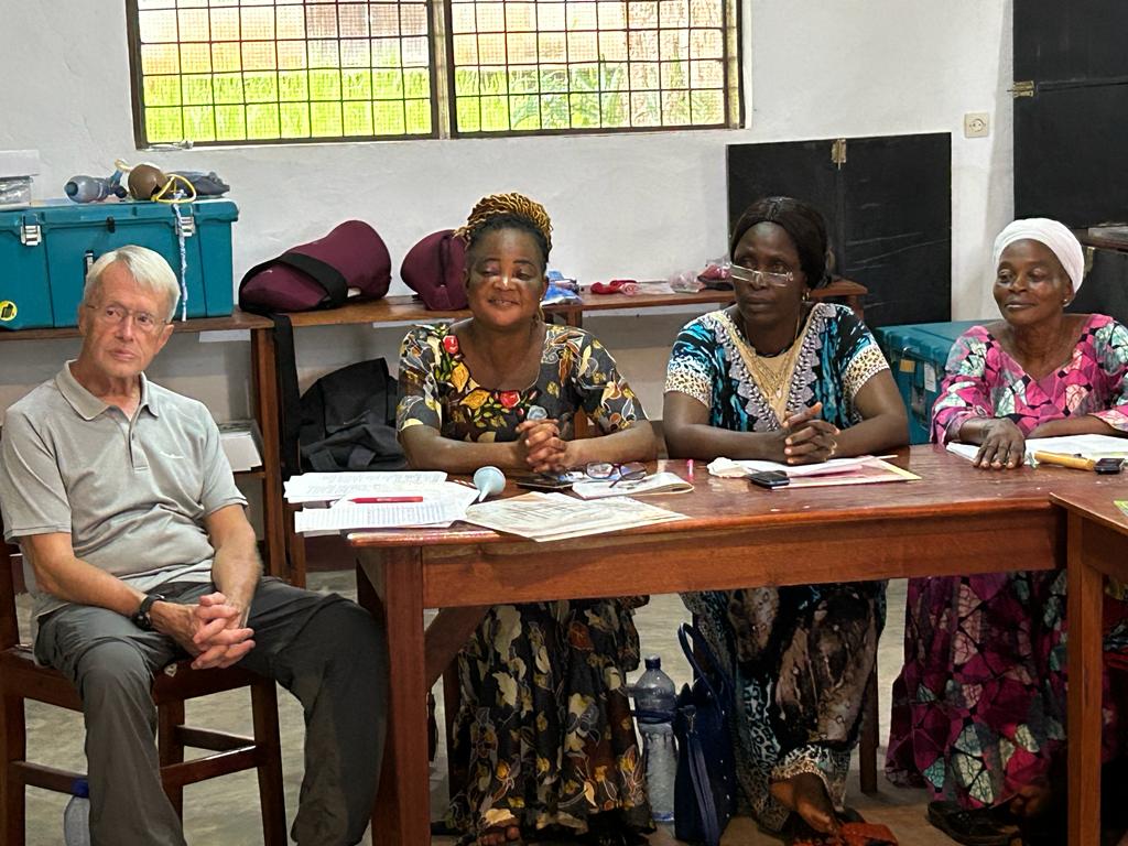 Jim Walker sitting with the Master Trainers.